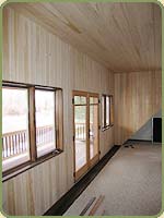 image of a wall with hemlock paneling.