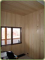 image of a wall with hemlock paneling.