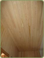 image of a wall with hemlock paneling.