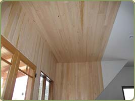 image of a wall with hemlock paneling.