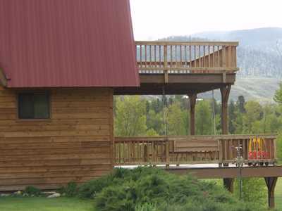 Weathered Western Red Cedar Siding, Trim, Beams, And Deck Railings With Stain